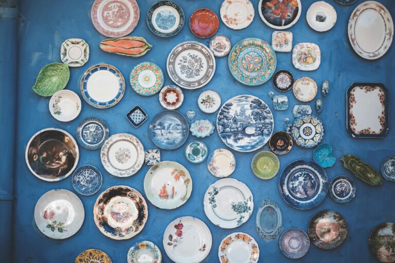 decorative plates on a blue wall